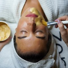 Woman relaxing during a nourishing facial treatment